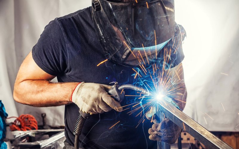 Man Weld A Metal With A Welding Machine